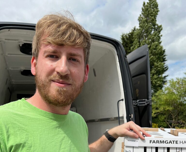 New appointment for FarmGate Hatcheries Damian Kowalski next to van